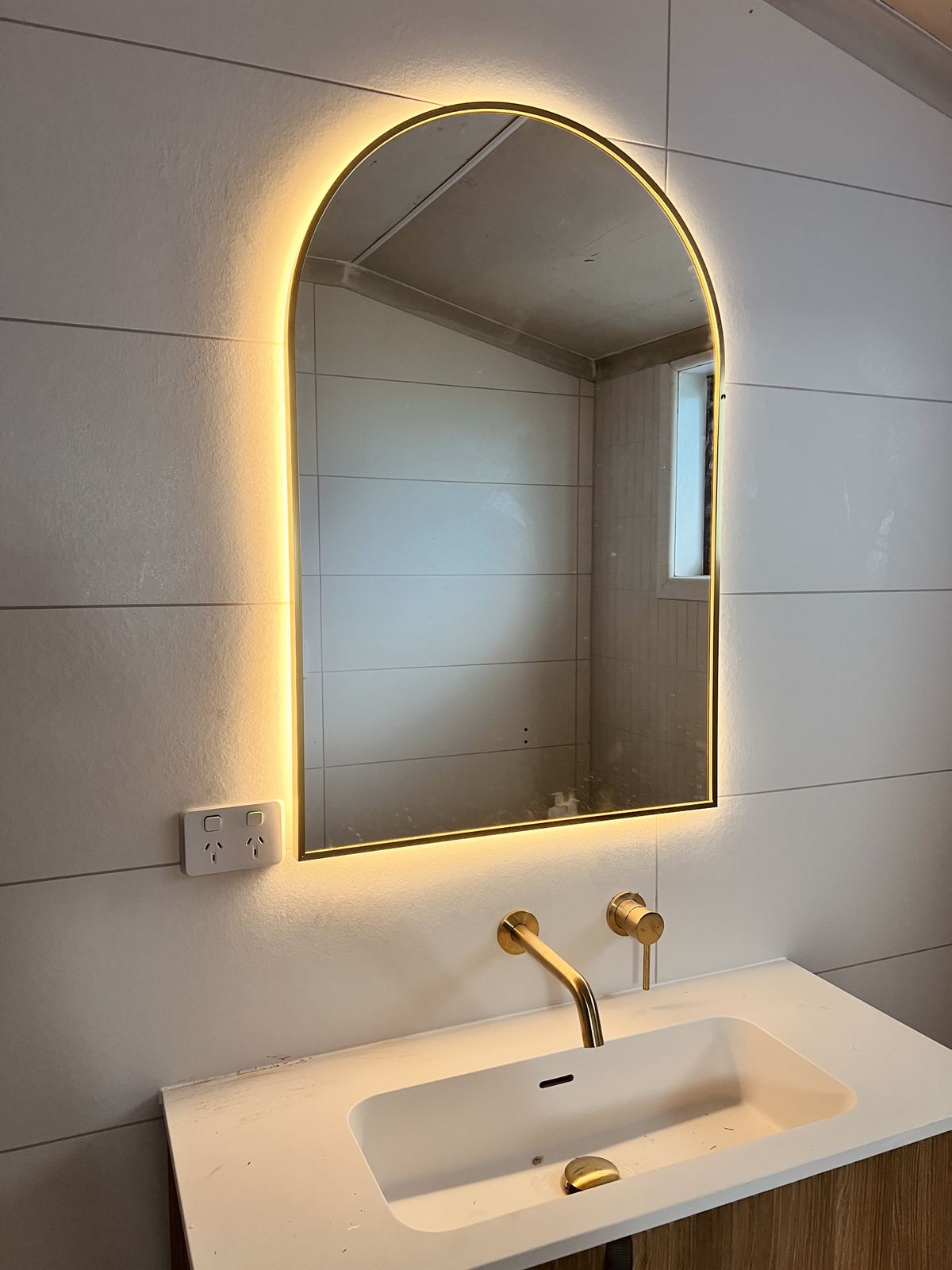 Backlit bathroom mirror and power point installation
