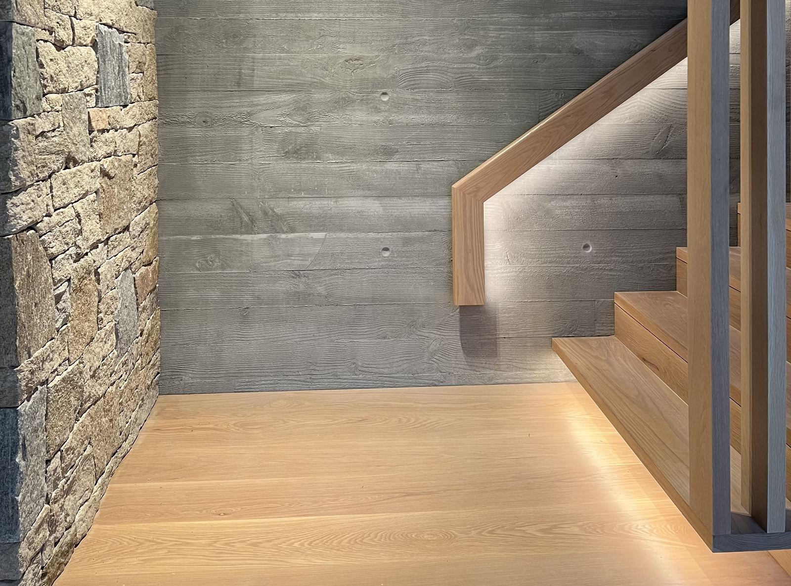 LED strip lighting under a stair handrail